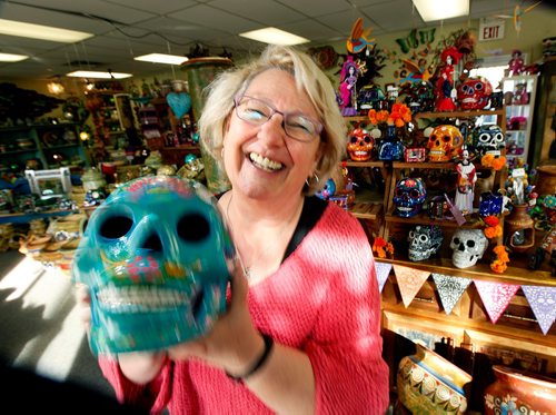 PHIL HOSSACK / WINNIPEG FREE PRESS  -  Susan Smandych her gracious laugh and a Day of the Dead skull welcome shoppers at "La Bodega". Dave Sanderson's story. SUNDAY SPECIAL  - Oct 19, 2017