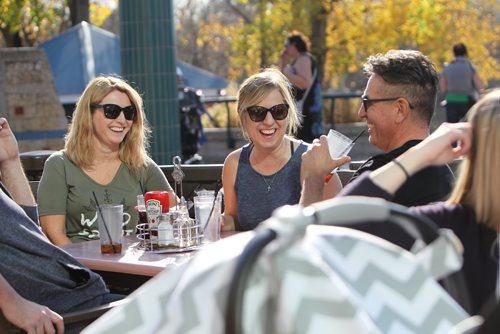 RUTH BONNEVILLE / WINNIPEG FREE PRESS

Winnipegers Debbie Delorme (left, green shirt) with her friend Susan Fedoruk,  Rob Fedoruk  and Chris Delorme (far left, not really in shot).  enjoy some laughs in unseasonably warm patio weather at Muddy Waters Restaurant at the Forks Friday afternoon.  
Weather Standup.  
See Joel Schlesinger

 
Oct 20,, 2017