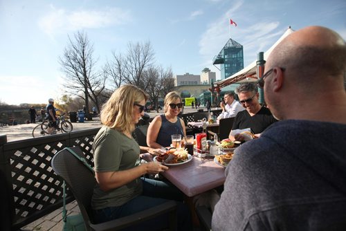 RUTH BONNEVILLE / WINNIPEG FREE PRESS

Winnipegers Debbie Delorme (left, green shirt) with her friend Susan Fedoruk,  Rob Fedoruk  and Chris Delorme (far right facing away),  enjoy some laughs in unseasonably warm patio weather at Muddy Waters Restaurant at the Forks Friday afternoon.  
Weather Standup.  
See Joel Schlesinger

 
 
Oct 20,, 2017