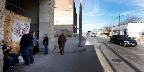 PHIL HOSSACK / WINNIPEG FREE PRESS  -  Homeless gather in a doorway along Princess  street near Siloam Misson Friday. See story. - Oct 20, 2017