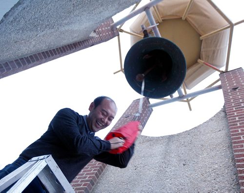 PHIL HOSSACK / WINNIPEG FREE PRESS  -  Jason Syvixay "rings the bell", an honor accorded presenters at the weekly gathering at the Bell. The public was invited to The Bell Tower, Selkirk Ave. and Powers St., at 6 p.m. today for a report highlighting the work of Meet Me at The Bell Tower and recommendations for planners when protest erupts in public spaces. Jason Syvixay, a master of city planning graduate student from the University of Manitoba, undertook the research. This will be a stdup with an extended cutline Scott Gibbons is writing. - Oct 20, 2017