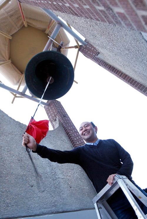 PHIL HOSSACK / WINNIPEG FREE PRESS  -  Jason Syvixay "rings the bell", an honor accorded presenters at the weekly gathering at the Bell. The public was invited to The Bell Tower, Selkirk Ave. and Powers St., at 6 p.m. today for a report highlighting the work of Meet Me at The Bell Tower and recommendations for planners when protest erupts in public spaces. Jason Syvixay, a master of city planning graduate student from the University of Manitoba, undertook the research. This will be a stdup with an extended cutline Scott Gibbons is writing. - Oct 20, 2017
