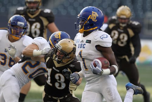 RUTH BONNEVILLE / WINNIPEG FREE PRESS

Sports 
UBC # 1 Trivel Pinto manages to get past U of M Bisons football pliers during the 2nd half of play at Investors Group Field Saturday.  
University of British Columbia team won the game with a score of 17-16.  
 
Oct 21,, 2017