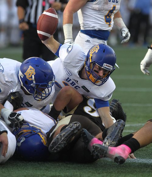 RUTH BONNEVILLE / WINNIPEG FREE PRESS

Sports 
UBC # 2 
 Cole Meyer holds onto the ball during scrum against the Bisons in the 2nd half of play at Investors Group Field Saturday.  
University of British Columbia team won the game against the U of M Bisons football team with a score of 17-16.  
 
Oct 21,, 2017
