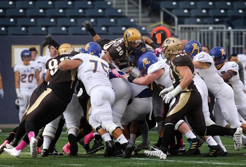 RUTH BONNEVILLE / WINNIPEG FREE PRESS

Sports 
Bisons players try and get some yards after contact during game against UBC at  Investors Group Field Saturday.  
University of British Columbia team won the game against U of M Bisons with a score of 17-16.  
 
Oct 21,, 2017
