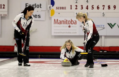 TREVOR HAGAN / WINNIPEG FREE PRESS
Jennifer Jones throws her shot as Jill Officer and Dawn McEwen sweep, while playing against the Englot rink at the curling club in Portage la Prairie, Sunday, October 22, 2017.
