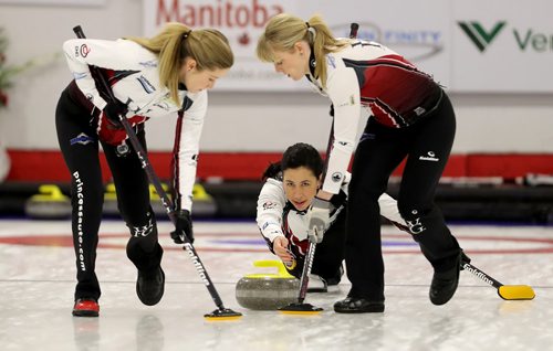 TREVOR HAGAN / WINNIPEG FREE PRESS
Team Jones' Jill Officer watches her shot as Kaitlyn Lawes and Dawn McEwen sweep, while playing against the Englot rink at the curling club in Portage la Prairie, Sunday, October 22, 2017.