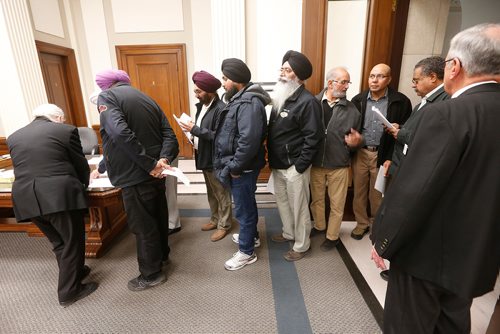 JOHN WOODS / WINNIPEG FREE PRESS
People lineup to sign in to speak at the hearing of Bill 30 - The Local Drivers for Hire Act in Winnipeg Monday, October 23, 2017.