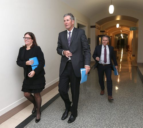 JASON HALSTEAD / WINNIPEG FREE PRESS

L-R: Justice Minister Heather Stefanson, Premier Brian Pallister and Finance Minister Cameron Friesen depart after taking part in a pre-budget consultation press conference at the Manitoba legislature building on Oct. 24, 2017.