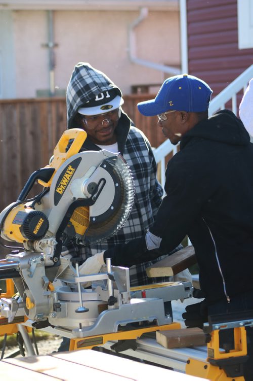 Canstar Community News Oct. 18, 2017 - Red River Colleges Language Training Centres Pathway Program to Construction Skills students Edouard Masuku and Martin Mukendi helped out with masonary at a Habitat for Humanity home located at 2003 Ross Ave. W. (LIGIA BRAIDOTTI/CANSTAR COMMUNITY NEWS/TIMES)