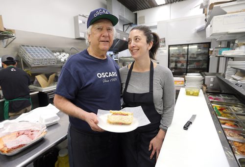 JASON HALSTEAD / WINNIPEG FREE PRESS

Larry Brown, owner of Oscar's Deli, and his daughter Rachel show off a corned beef sandwich at the Hargrave Street deli on Oct. 24, 2017.
(Re: INTERSECTION - old restos)
