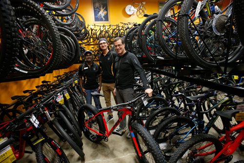 WAYNE GLOWACKI / WINNIPEG FREE PRESS

49.8 From right, Tim Woodcock, owner of Woodcock Cycle with sales associates Kelsey Unger and Jude Gunasekera .    Jessica Urbanski story Oct.31 2017