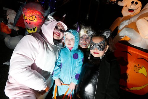 JOHN WOODS / WINNIPEG FREE PRESS
From left, Lorne Clark, Gorgeous Couture, grandmother Lee-Ann Couture and Precious Couture were out trick or treating on Flora Avenue Tuesday, October 31, 2017.