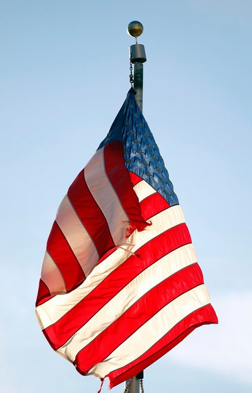 PHIL HOSSACK / WINNIPEG FREE PRESS  -  A little tattered, the Stars and Stripes still wave over Fargo's Broadway avenue on Tuesday. See Melissa Martin feature. - Oct 24, 2017