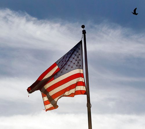 PHIL HOSSACK / WINNIPEG FREE PRESS  -  A little tattered, the Stars and Stripes still wave over Fargo's Broadway avenue on Tuesday. See Melissa Martin feature. - Oct 24, 2017