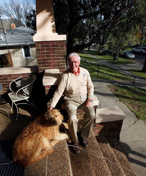 PHIL HOSSACK / WINNIPEG FREE PRESS  - Bismark's Bob Wefald, former North Dakota Attorney General and District Court Judge, and his Goldendoodle pose on the front step of his home. See Melissa Martin feature. - Oct 24, 2017
