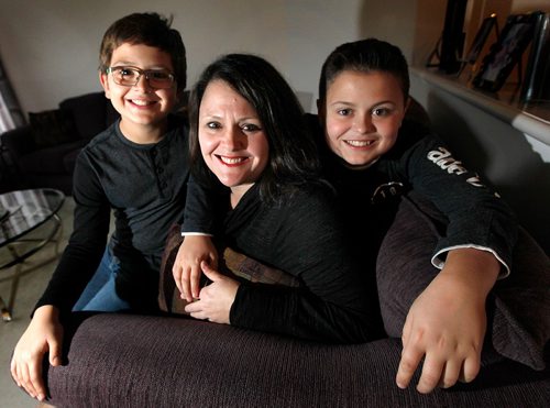 PHIL HOSSACK / WINNIPEG FREE PRESS  - Chantelle Maksymetz lives with rheumatoid arthritis and is grateful for the support she gets from the Arthritis Society. Posing with sons Aiden (13) and Ridley (19, right)
 Alex Paul United Way story. - November 1, 2017