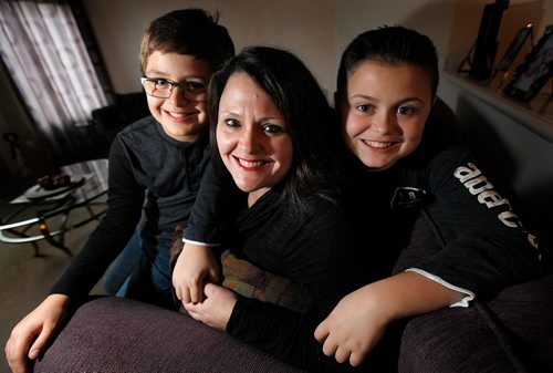 PHIL HOSSACK / WINNIPEG FREE PRESS  - Chantelle Maksymetz lives with rheumatoid arthritis and is grateful for the support she gets from the Arthritis Society. Posing with sons Aiden (13) and Ridley (19, right)
 Alex Paul United Way story. - November 1, 2017