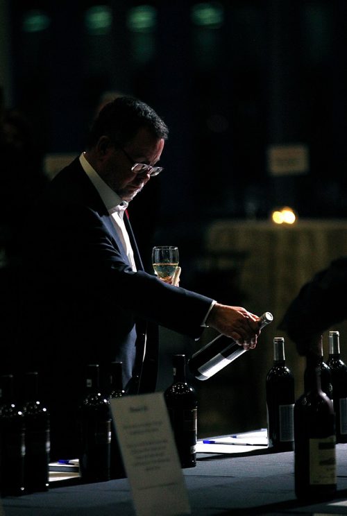 PHIL HOSSACK / WINNIPEG FREE PRESS  - A patron checks the wines on displat at the Gold Medal Plates event Wednesday evening at the RBC Convention Centre. See release. - November 1, 2017
