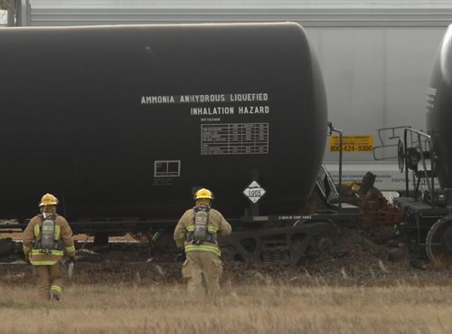 Brandon Sun Brandon firefighters look over the cars derailed Wednesday afternoon in the city's east end. Some of the cars were carrying anhydrous ammonia. (Colin Corneau/Brandon Sun)