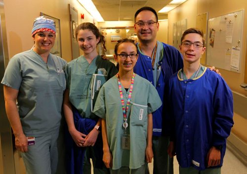 CLARA GIBBONS / WINNIPEG FREE PRESS
Take Our Kids to Work Day - Parents and Kids at St. Boniface Hospital where the Grade 9 students got to spend some time in OR during an open heart surgery. From left, Nurse Jan Fair with her daughter McKayla, and Dr. Trevor Lee and his kids Isabella and Sam. Nov. 1, 2017