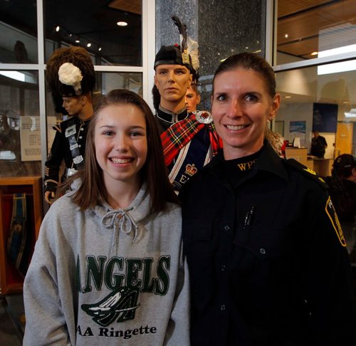 NADIA MINKEVICH / WINNIPEG FREE PRESS
Take Our Kids to Work Day  - Winnipeg Police Service Patrol Sergeant School Education Section Wendy Basic, right, with her grade 9 daughter Taylor, left, pose for a photo at the Police Museum at HQ. Nov. 1, 2017