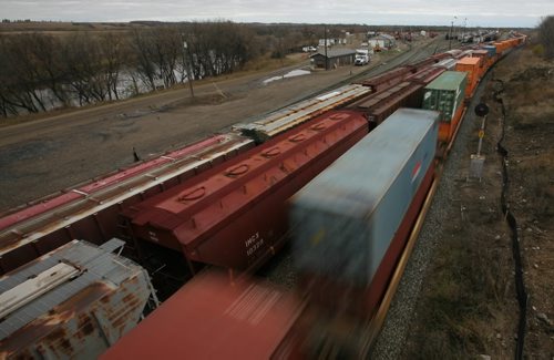 Brandon Sun A long trains pulls out of the Canadian Pacific Rail yard on Wednesday afternoon. (Bruce Bumstead/Brandon Sun)