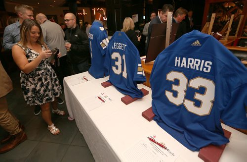 JASON HALSTEAD / WINNIPEG FREE PRESS

Signed jerseys were part of the auction at the Hearts of Blue and Gold Bomber Dinner at Earls Kitchen and Bar on Main St. on Oct. 24, 2017, a fundraiser for Variety, the Childrens Charity of Manitoba. (See Social Page)
