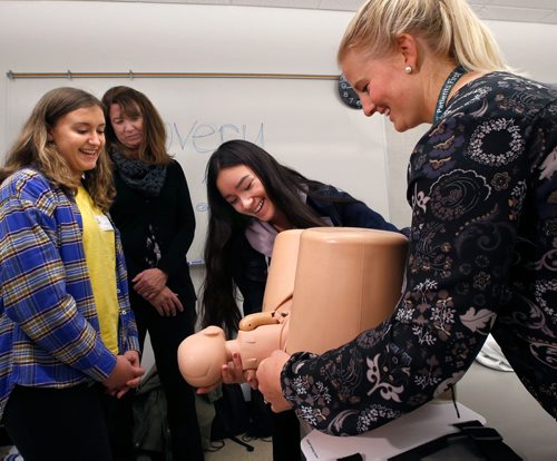 WAYNE GLOWACKI / WINNIPEG FREE PRESS

In centre, Deanna Chanthavong from Morris School was successful using the child delivery simulator during the Human Reproduction Workshop with assistance from Registered Nurse Andi Wilgosh. She was among the more than 370 high school students and teachers from 81 schools across Winnipeg and surrounding areas  attending Discovery Day Friday at the University of Manitobas Bannatyne Campus Friday  to explore careers in medicine, rehab sciences, pharmacy, nursing and other health sciences.   2017