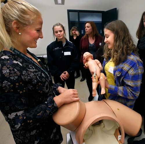 WAYNE GLOWACKI / WINNIPEG FREE PRESS

At right, Hillary Jorgenson a student from Morris School was successful using the child delivery simulator during the Human Reproduction Workshop with assistance from Registered Nurse Andi Wilgosh. The newborn baby doll brought smiles despite having a leg rotated backwards and missing an arm.  Hillary was among the more than 370 high school students and teachers from 81 schools across Winnipeg and surrounding areas  attending Discovery Day Friday at  the University of Manitobas Bannatyne Campus Friday  to explore careers in medicine, rehab sciences, pharmacy, nursing and other health sciences.   2017