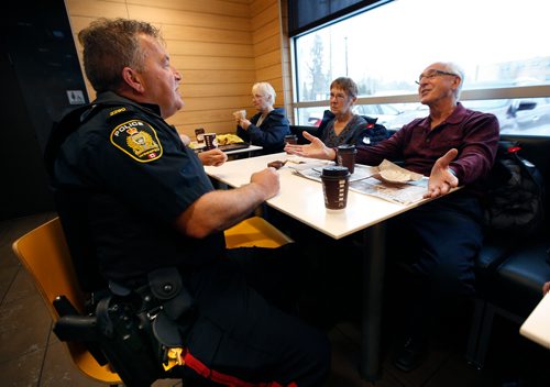 WAYNE GLOWACKI / WINNIPEG FREE PRESS

At right, Dennis Stokotelny and his wife Virginia chat with Winnipeg Police officer Const. Sean Donovan at the Coffee with a Cop event Saturday held at McDonalds at 2475 Portage Ave. The informal gathering is a chance for residents to ask questions, voice concerns, and get to know the officers in their neighbourhood.  Alex Paul story   Nov. 4 2017