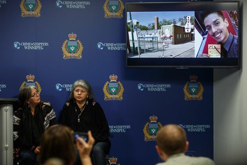 MIKE DEAL / WINNIPEG FREE PRESS
Lydia Pratt (left) looks at a photo of her son displayed on a monitor during a press conference at the Police HQ the day before the third anniversary of when her son Colten Pratt went missing. She attended the press conference with Jacqueline Daniels (right), Coltens Pratt's aunt.
171106 - Monday, November 06, 2017.