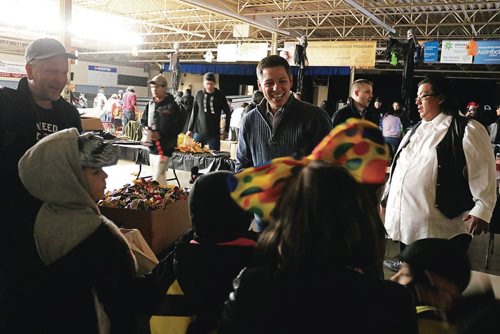 Canstar Community News Oct. 31, 2017 - Mayor Brian Bowman hands out candy to children at the Indian and Metis Friendship Centres Safe Halloween. (LIGIA BRAIDOTTI/CANSTAR COMMUNITY NEWS/TIMES)