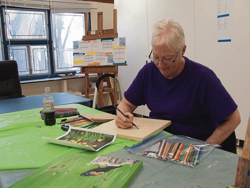 Canstar Community News Fran Dales hard at work on a coloured pencil sketch of a bunch of tulips. Dales' work will be among the pieces shown at the Local Colour Art Group Annual Exhibit and Sale on Nov. 17-19 at 180 Poplar Ave. (SHELDON BIRNIE/CANSTAR/THE HERALD)