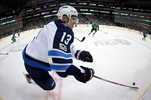 TREVOR HAGAN / WINNIPEG FREE PRESS
Winnipeg Jets' Brandon Tanev (13) carries the puck while playing against the Dallas Stars' during second period NHL action in Dallas, Monday, November 6, 2017.