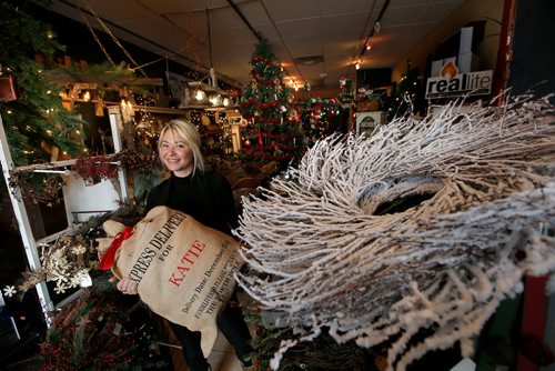 WAYNE GLOWACKI / WINNIPEG FREE PRESS 

Sunday Special. As Time Goes By Home Decor at 442 Academy Rd. owner Katie James with her Christmas sack.  David Sanderson story. Nov. 7 2017