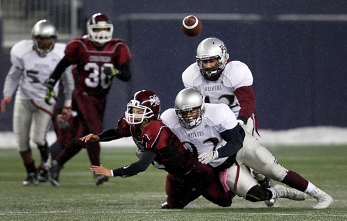 PHIL HOSSACK / WINNIPEG FREE PRESS  - Daniel Mac Maroon quarter back #11 Kieran Benson goes down to EK Reivers #42 Rajbir Singh (top) and #22 Connor Becker after fumbling the hand off Wednesday night in Footbal final action. See Mike Sawatzsky story. - November 8,