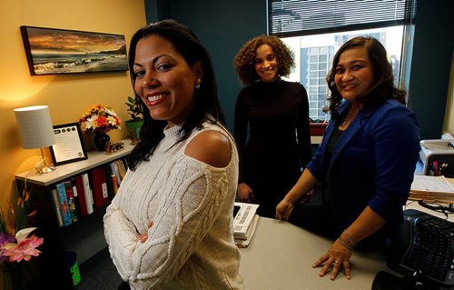 PHIL HOSSACK / WINNIPEG FREE PRESS  -.left to right Maria Duque, who's a former client and now working,  Lisandra Llamos Lopez with co-worker Maritess Matienzo both are facilitators at Opportunities for Employment, a United Way Program. See Carol Sanders story.  - November 9, 2017