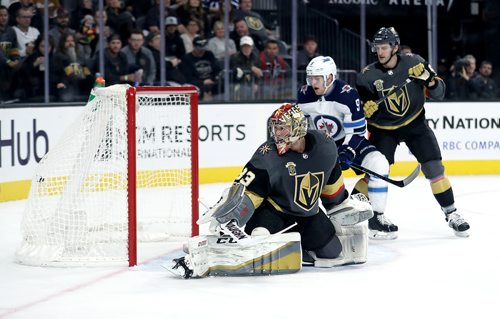 TREVOR HAGAN / WINNIPEG FREE PRESS
Vegas Golden Knights goaltender, Maxime Lagace (33) looks back at the puck as Winnipeg Jets' Adam Lowry (17)  scored during first period NHL action at T-Mobile Arena, in Las Vegas, Friday, November 10, 2017.