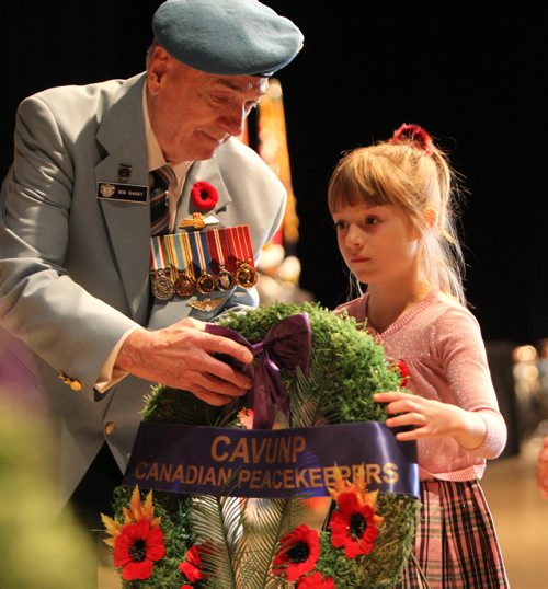 RUTH BONNEVILLE / WINNIPEG FREE PRESS

Annabelle Barry (7yrs) lays wreath with her great grandfather, Capt  Bob Barry Capt. (Peacekeepers) during the annual Winnipeg Remembrance Day Service, (hosted by the joint Veterans Assoc. of MB), at RBC Convention Centre Saturday.  

See Ryan Thorpe story. 

Nov 11, 2017