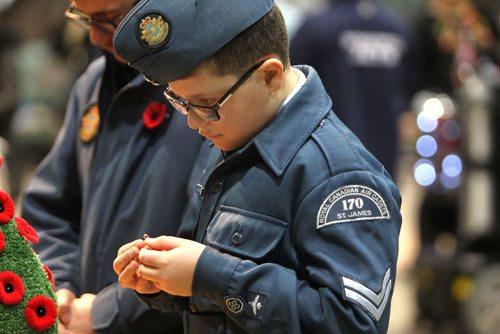 RUTH BONNEVILLE / WINNIPEG FREE PRESS

Cadet Gianluca Caldarola (13yrs) pins his poppy on the cenotaph after the annual Winnipeg Remembrance Day Service, at RBC Convention Centre Saturday.  

See Ryan Thorpe story. 

Nov 11, 2017