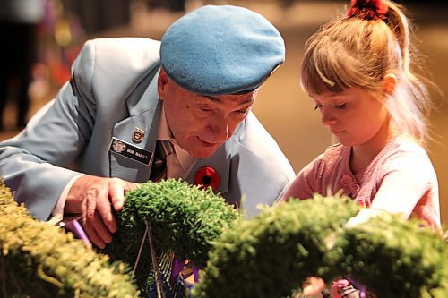RUTH BONNEVILLE / WINNIPEG FREE PRESS



Annabelle Barry (7yrs) lays wreath with her great grandfather, Capt  Bob Barry Capt. (Peacekeepers) during the annual Winnipeg Remembrance Day Service, (hosted by the joint Veterans Assoc. of MB), at RBC Convention Centre Saturday.  



See Ryan Thorpe story. 



Nov 11, 2017