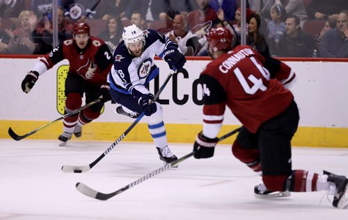 TREVOR HAGAN / WINNIPEG FREE PRESS
Winnipeg Jets' Bryan Little (18) fires a shot that is blocked by Arizona Coyotes' Kevin Connauton (44) during first period NHL action at Gila River Arena in Glendale, Arizona, Saturday, November 11, 2017.