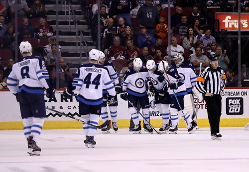 TREVOR HAGAN / WINNIPEG FREE PRESS
Winnipeg Jets' Tyler Myers (57) is helped off the ice after getting hurt while playing against the Arizona Coyotes' during third period NHL action, in Glendale Arizona, Saturday, November 11, 2017.