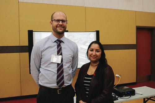 Canstar Community News Nov. 7, 2017 - Public Works transportation and planning engineer Scott Suderman (left) and Old Kildonan ward coun. Devi Sharma (second left) at the Chief Peguis Trail Extension information session on Nov. 7 at Red River Community Centre. (LIGIA BRAIDOTTI/CANSTAR COMMUNITY NEWS/TIMES)