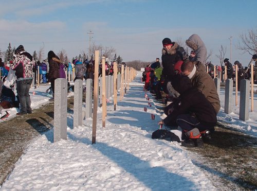 Canstar Community News Nov. 6, 2017 - Approximately 500 Grade 6 students from River East-Transcona School Division paid tribute to fallen soldiers and veterans at the No Stone Left Alone event at the Transcona Cemetery. (SHELDON BIRNIE/CANSTAR/THE HERALD