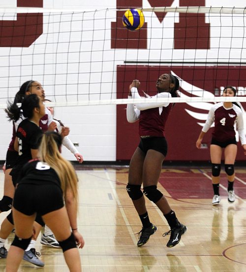 PHIL HOSSACK / WINNIPEG FREE PRESS  - Daniel McIntyre's Rusheda Gibbs recoils as her hit bounces back after failing to clear the net against Sisler's Trojan Tuesday night. The Maroons took the match 3-0 on their home court.  - November 14, 2017