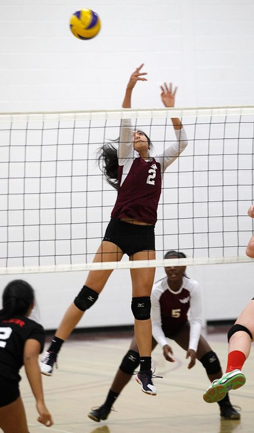 PHIL HOSSACK / WINNIPEG FREE PRESS  - Daniel McIntyre's Allison Conception goes high reaching for a block against Sisler's Trojan Tuesday night. The Maroons took the match 3-0 on their home court.  - November 14, 2017