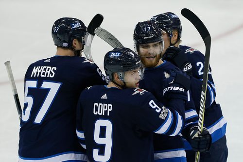 JOHN WOODS / WINNIPEG FREE PRESS
Winnipeg Jets' Tyler Myers (57), Andrew Copp (9), Adam Lowry (17)¤ and Patrik Laine (29) celebrate Lowry 's second goal of the game against the Arizona Coyotes during second period NHL action in Winnipeg on Tuesday, November 14, 2017.