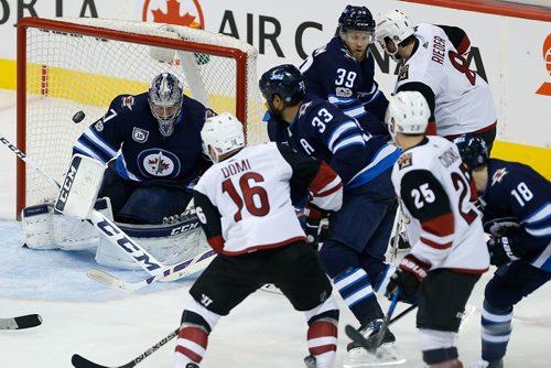 JOHN WOODS / WINNIPEG FREE PRESS
Winnipeg Jets goaltender Connor Hellebuyck (37) saves the shot from Arizona Coyotes' Max Domi (16) during second period NHL action in Winnipeg on Tuesday, November 14, 2017.